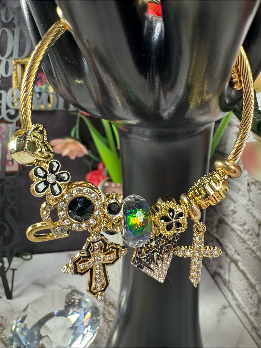Gold-Tone Multi Charm Bracelet with Black and Iridescent Accents